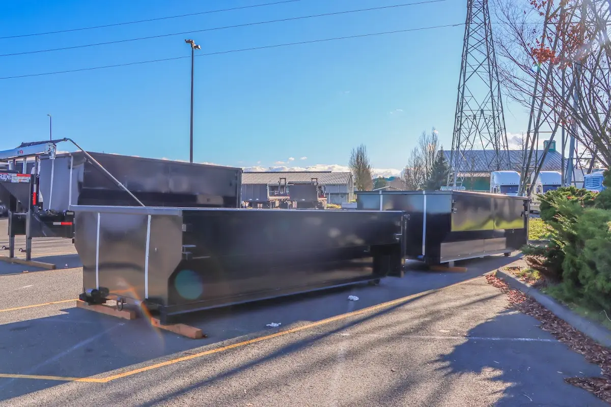 Roll-off dumpster ready for waste disposal at job site for Yard Waste Dumpster Rental in Harrisonville